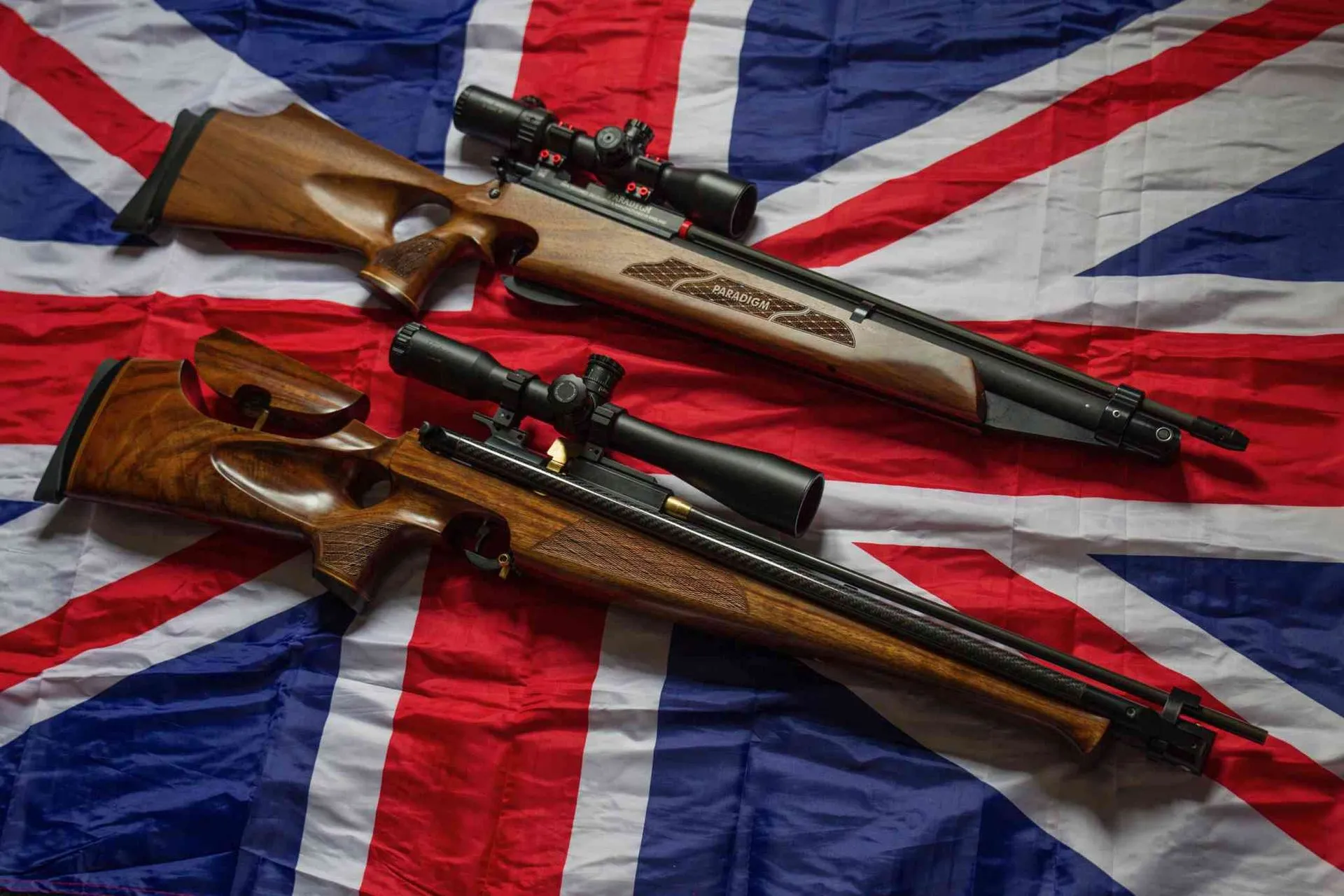 The Webley Paradigm and a bespoke Daviesbuilt rifle on a Union Jack